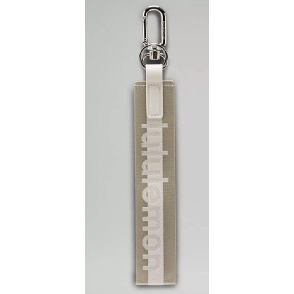 0269  NWT Lululemon Never Lost Keychain- Raw Linen/White Opal/White