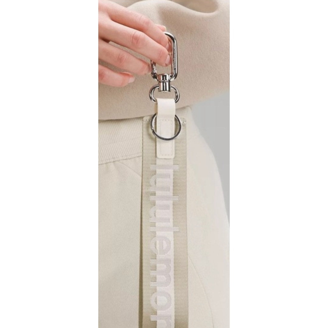 0269  NWT Lululemon Never Lost Keychain- Raw Linen/White Opal/White