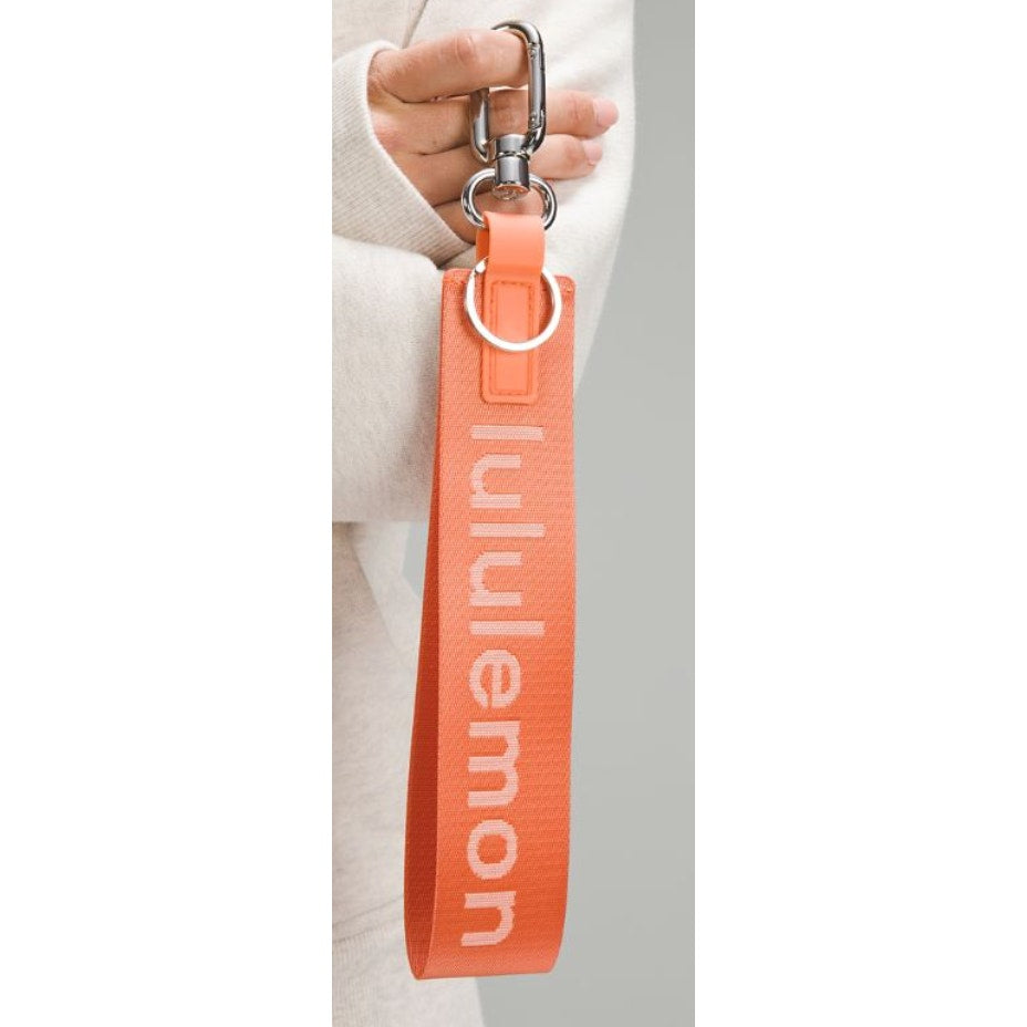 6552 NWT Lululemon Never Lost Keychain- CORAL KISS *SOLD OUT