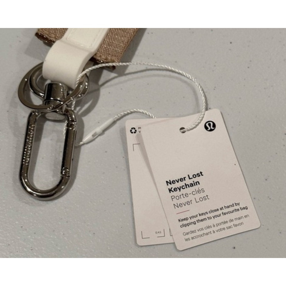 0269  NWT Lululemon Never Lost Keychain- Raw Linen/White Opal/White